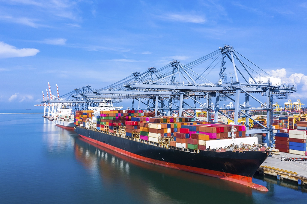 Container ship arriving at commercial port